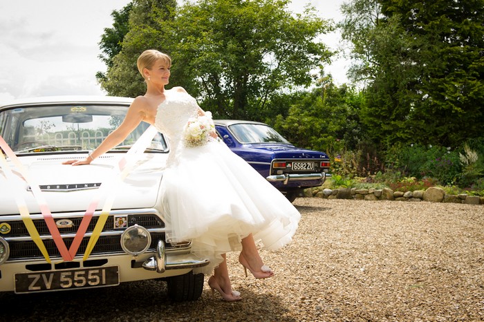 bride on cadillac wedding car
